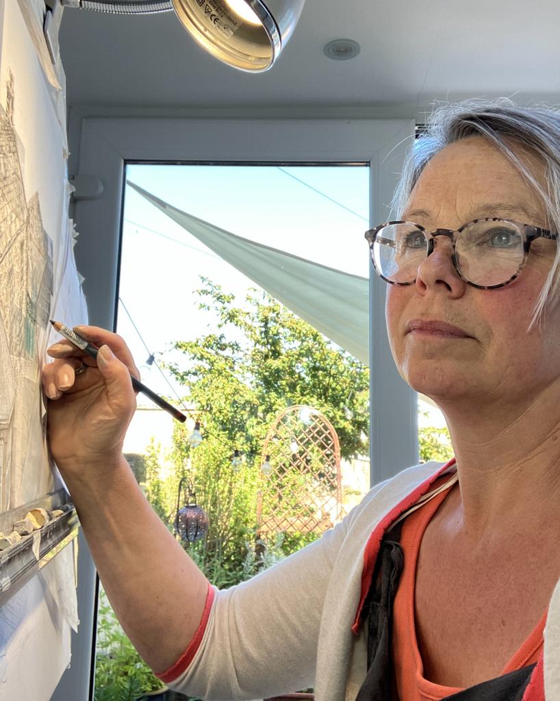 Rebecca painting onto canvas