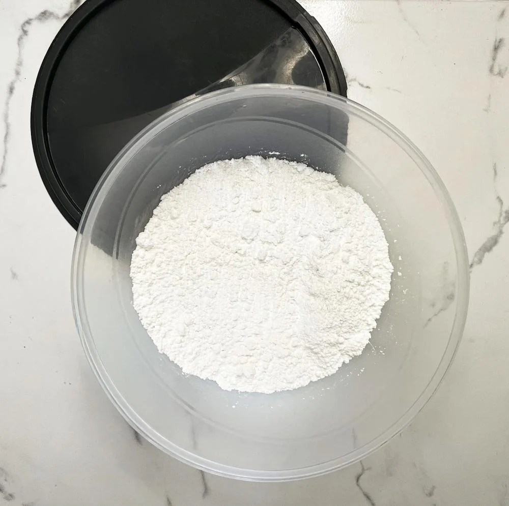 Powdered sugar in a large mixing bowl