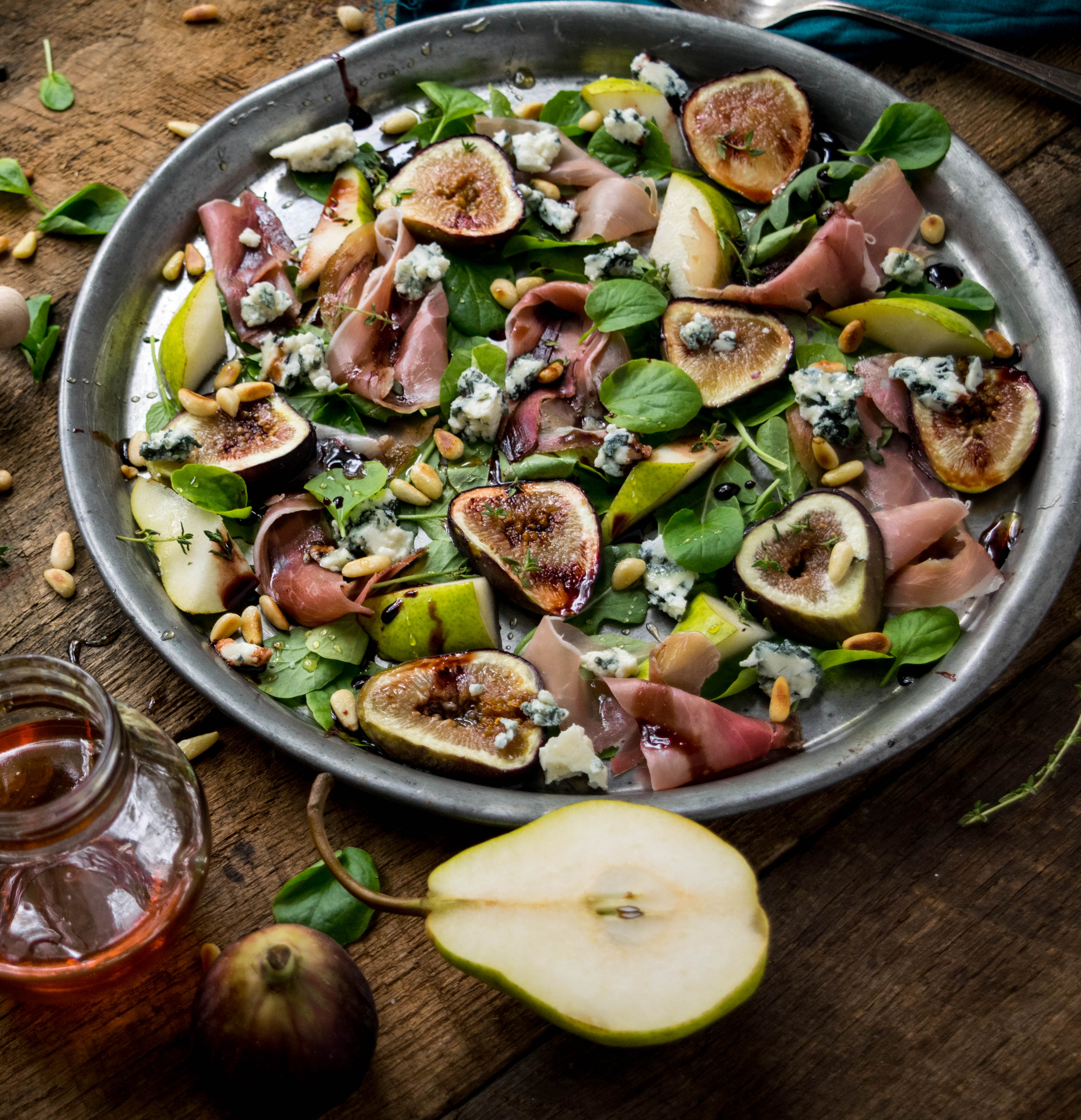 Fig Salad with Prosciutto, Toasted Pine Nuts, and Honey Red Wine Reduction