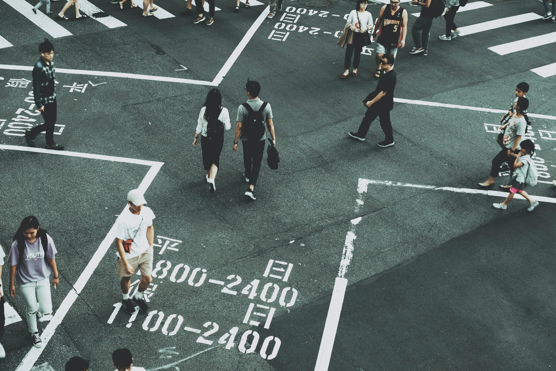 people standing on road close up photography