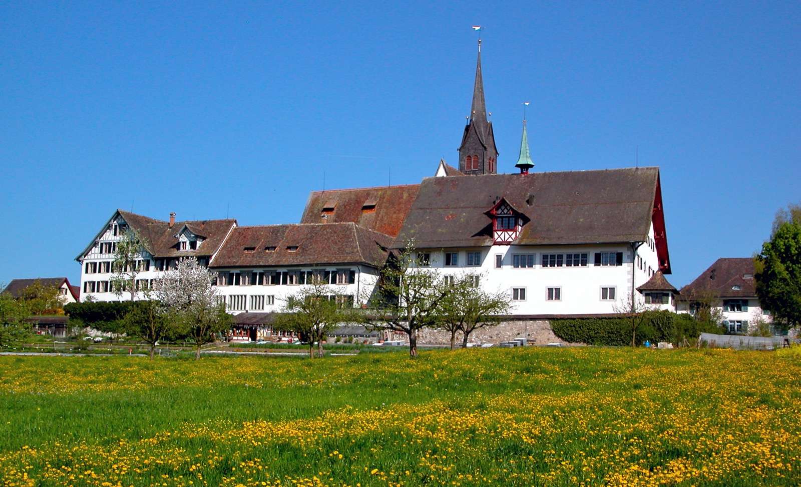 Monastery buildings at Kappel amid a green meadow