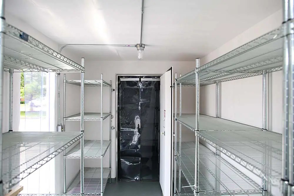 Custom-fit walk-in cooler door being installed