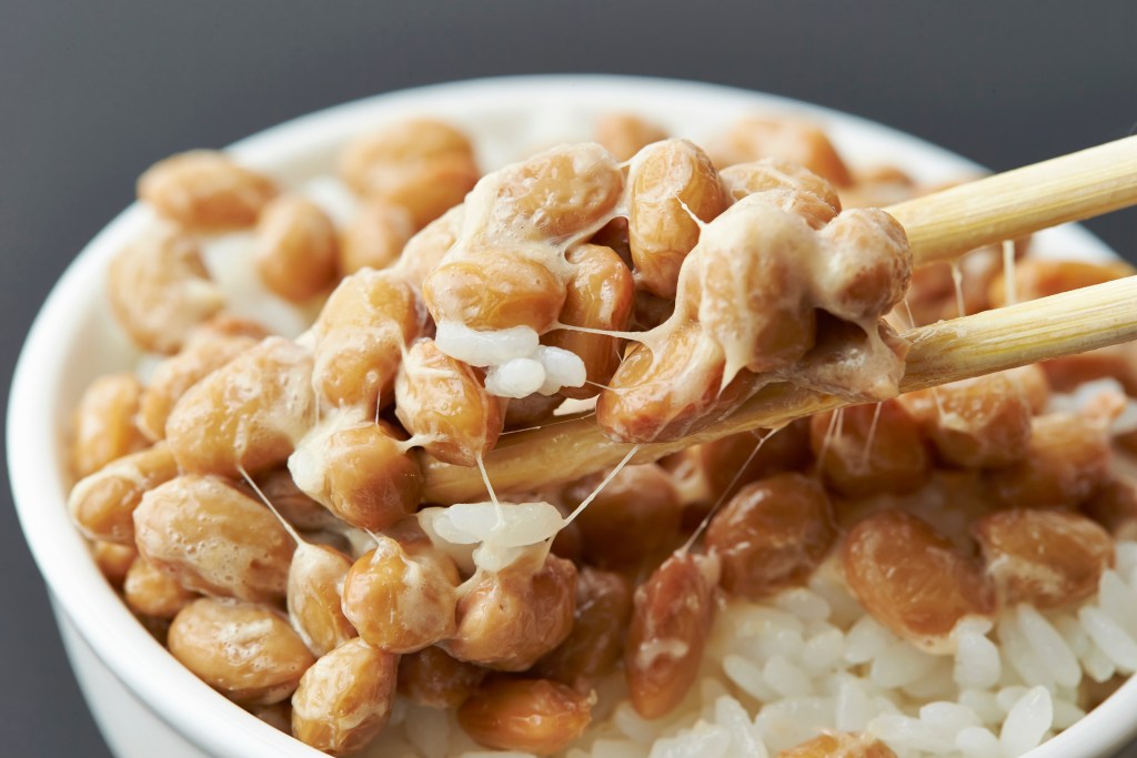Up close picture of Natto Beans with white rice.