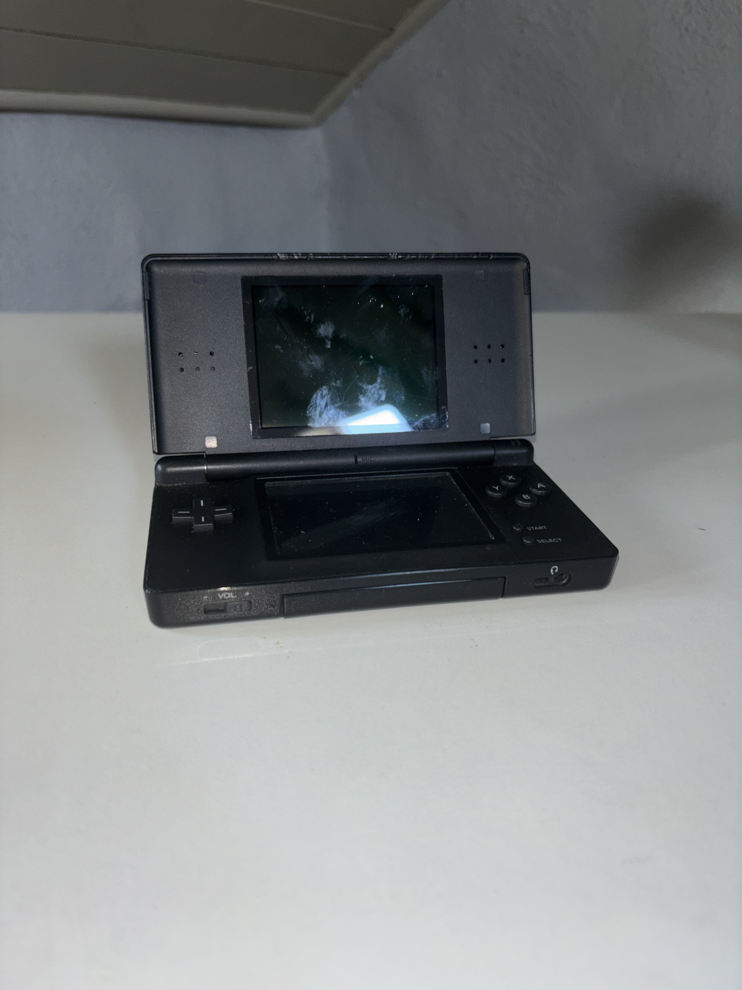 Nintendo DS Lite Black, Model No. USG-001, Released 2006. Owned from 2006- Present. Image taken by Luke Coleman.