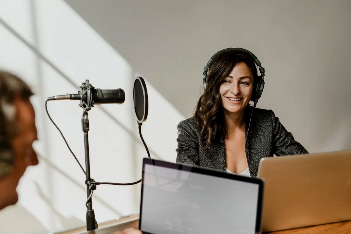 The best remote jobs for introverts: Female broadcaster interviewing her guest in a studio