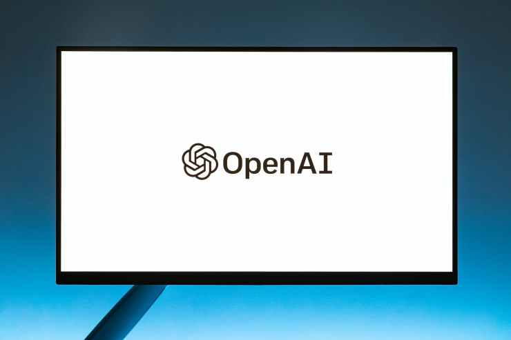 monitor screen with openai logo on white background