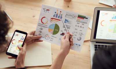 colleagues looking at survey sheet