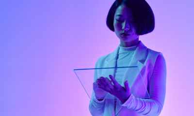 a woman holding a digital tablet