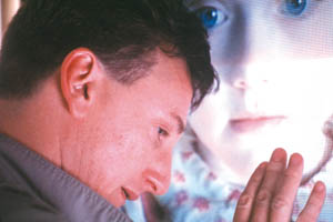 Sean Penn worships at the altar of an amazingly huge child.