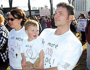 A family affair: Hunter, 2, and his dad, Corey Lewis, a UNR instructor and grad student, express their dismay at the idea of war with Iraq. Hunter’s mom, Micki, made the T-shirts.