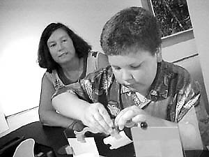 Brendan Aguilar, 10, does some architectural design with plastic Mattel toys at the new Nevada Museum of Art. That’s his mom, Roseann, supervising the construction.