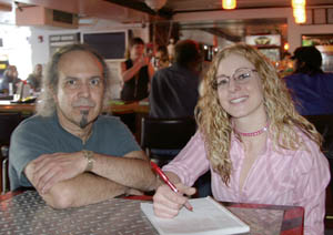 Tavern Tour organizers David Muskin and Stephanie Otto pose as though planning an event in the Davidson’s Distillery bar.