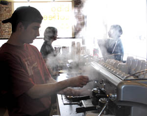 Trent O’Neil, who has worked at Bibo for about a year, steams up a vanilla latte.