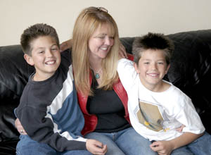 Laura Ramirez’ turquoise pendant is a metaphor for her child-rearing philosophy: A parent’s job isn’t to try to shape the gem but to add the polish. Her sons, Dakotah, 11 (left) and Colt, 9, have their own pieces of tuquoise, too.
