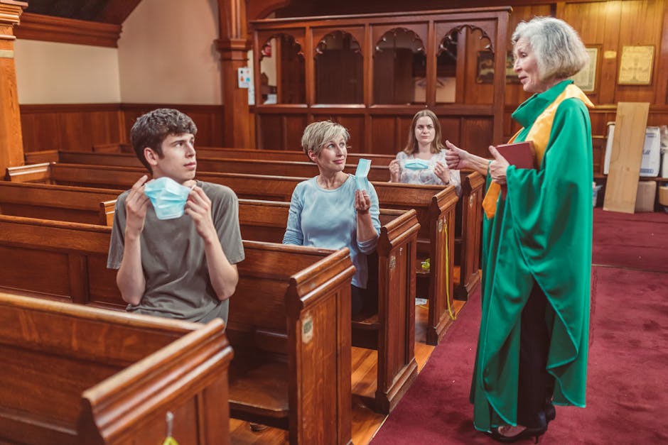 Priest and congregation discuss while following health protocols inside a historic church.