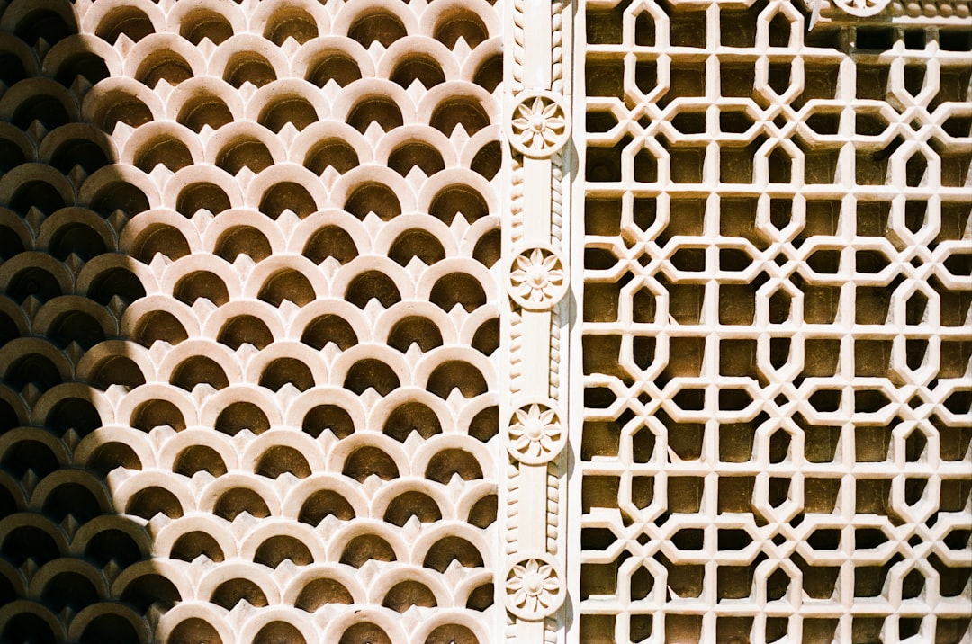 A close up of a metal grate with holes