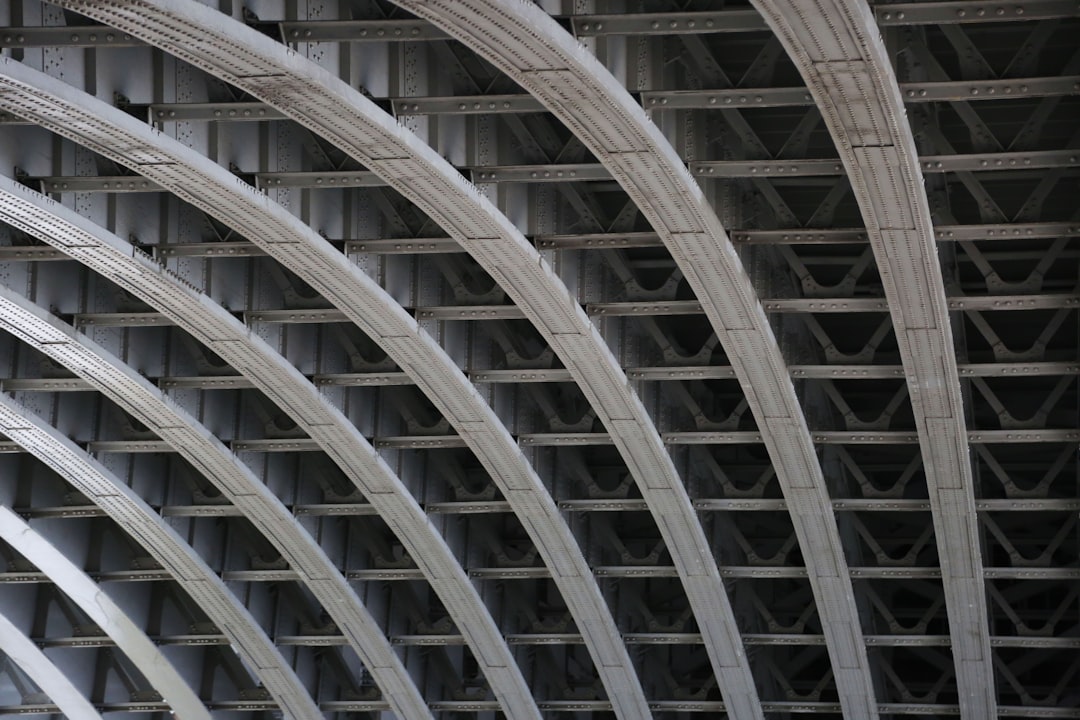 A close up of a metal structure with a clock on it
