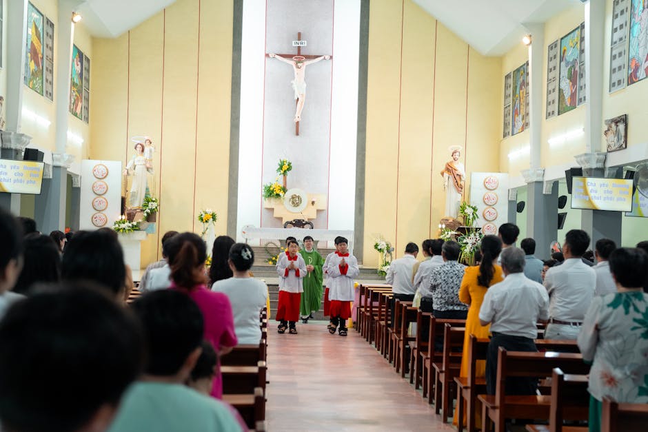 A vibrant Catholic mass with congregation and altar boys in a beautifully decorated church setting.