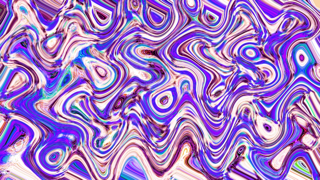 Abstract swirls in shades of purple and blue.