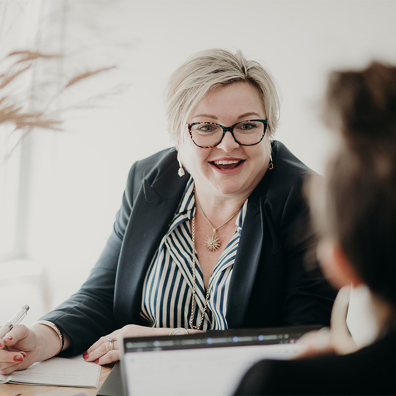 Professional woman smiling in meeting
