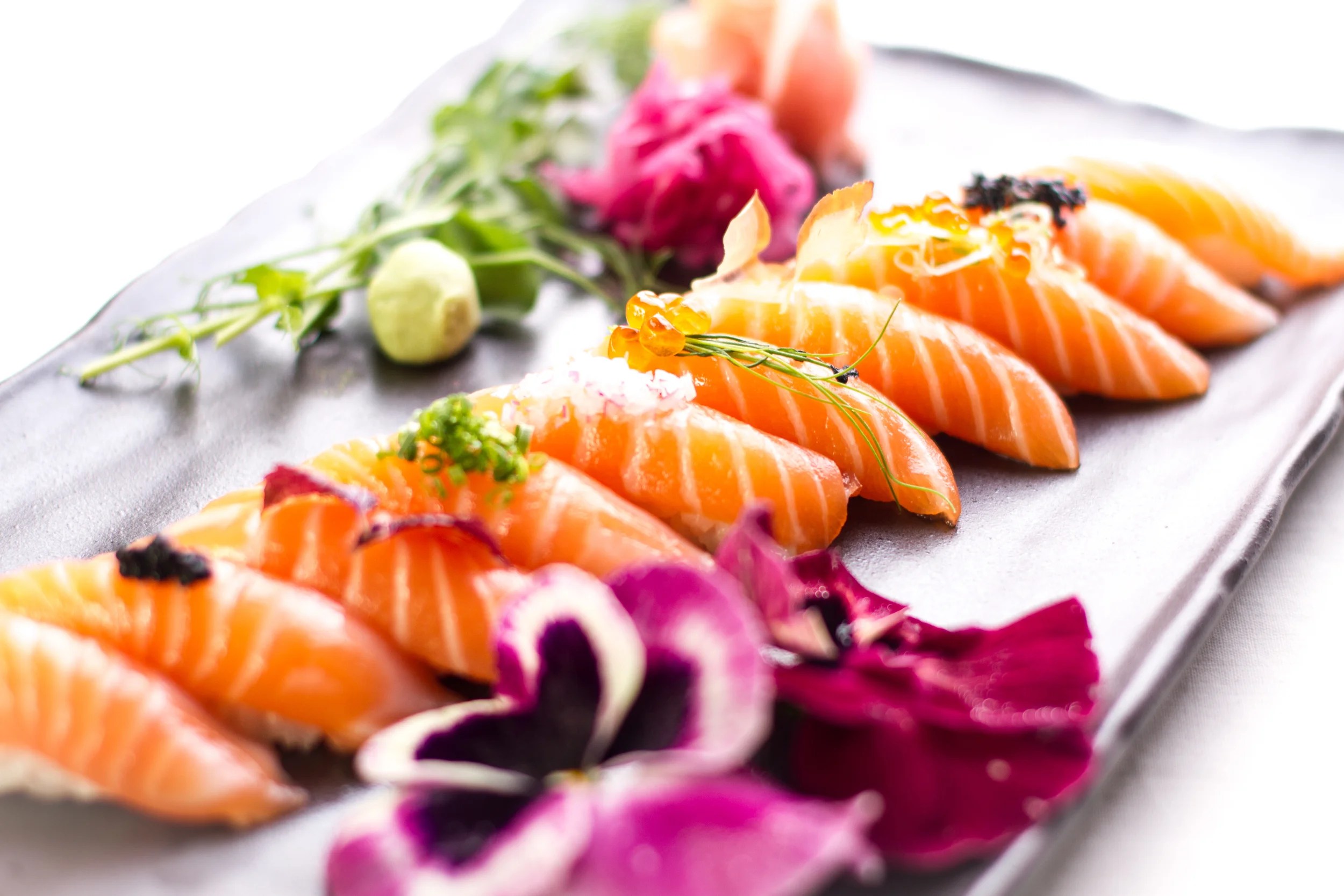 Salmon nigiri with colourful toppings and flowers at Samba Sushi