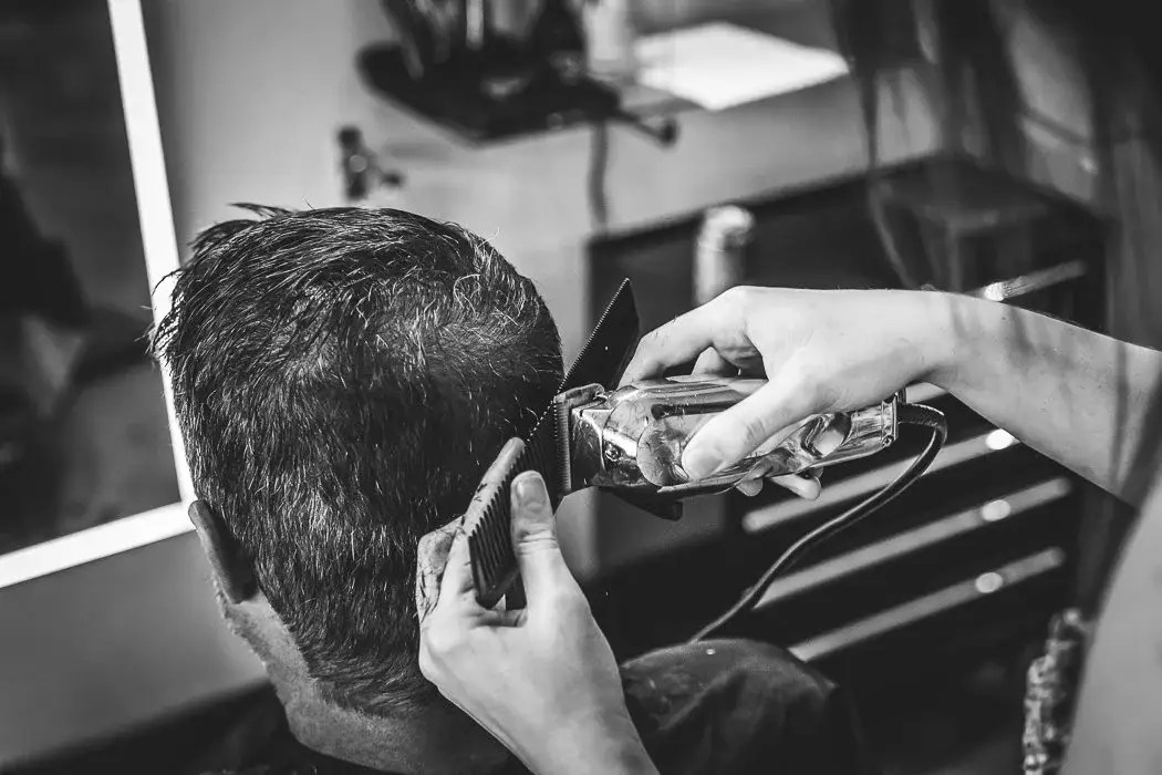 Haircut with clippers black and white image