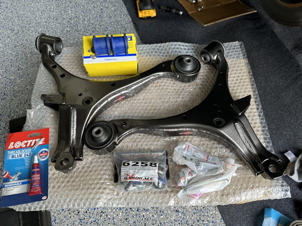 Overview of Parts Picture 1: KTuned Front Lower Control Arm, Hardware front sway bar end links, new sway bar bushings and OEM Honda Hardware.