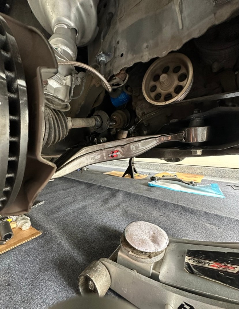 KTuned Front Lower Control Arm connected to the RSX.