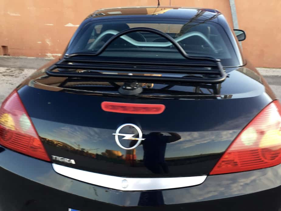 black opel vauxhall tigra with a luggage rack fitted
