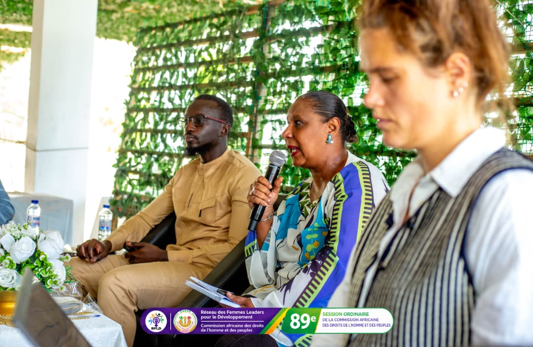 A panellist responds during the first round of questions, under the WLICT banner.