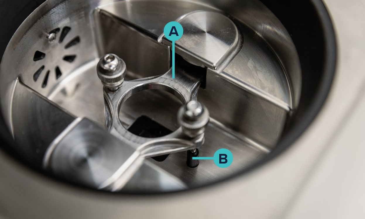 A: ElastoSens™ Bio's mechanical unit for sample placement, B: Temperature sensor.