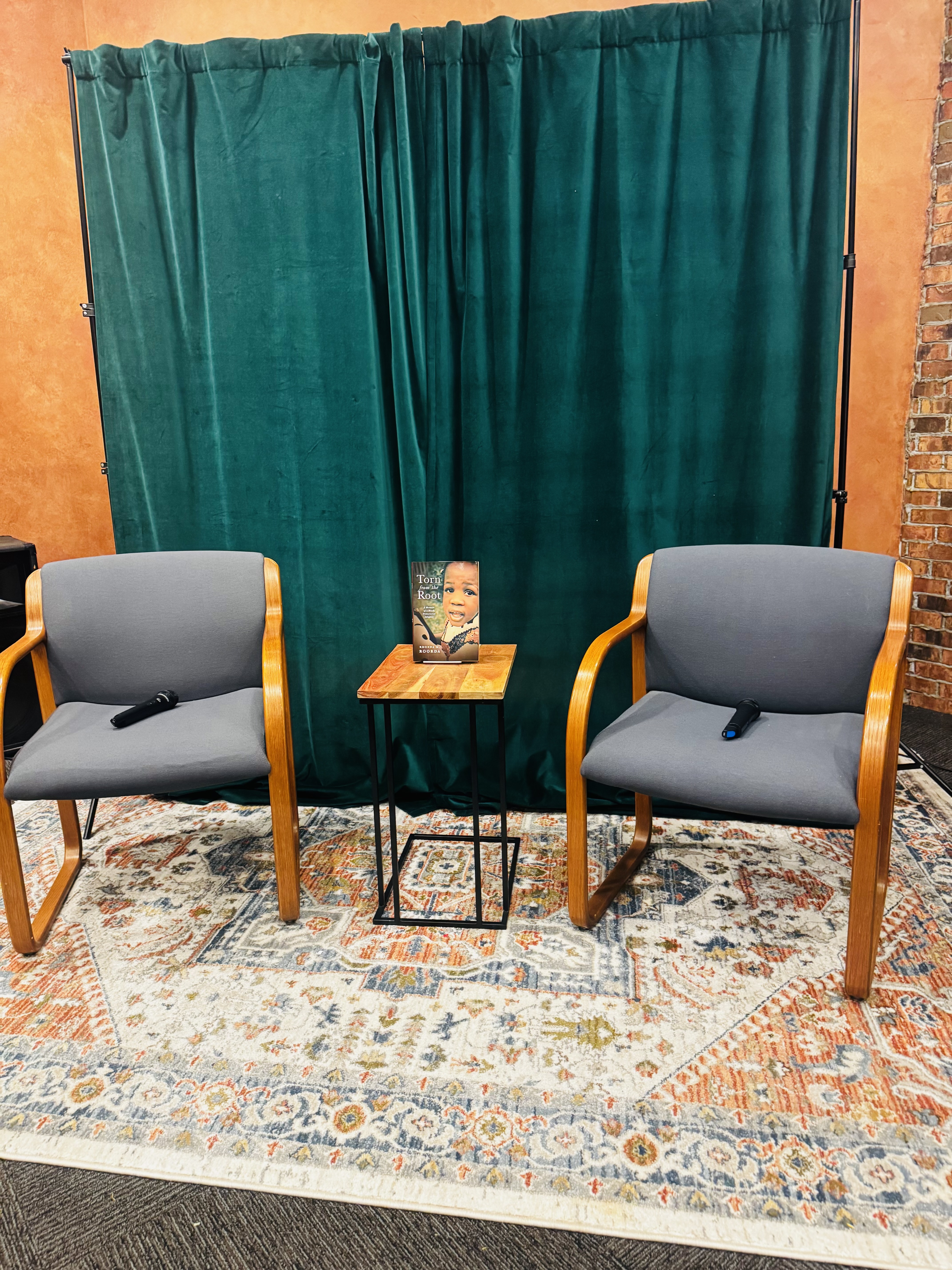 Two chairs prepared for a Torn from the Root author conversation