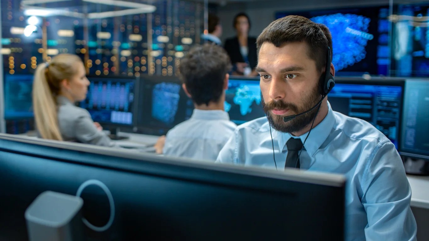 Analyst facing computer screen. Managed Security Services Provider.