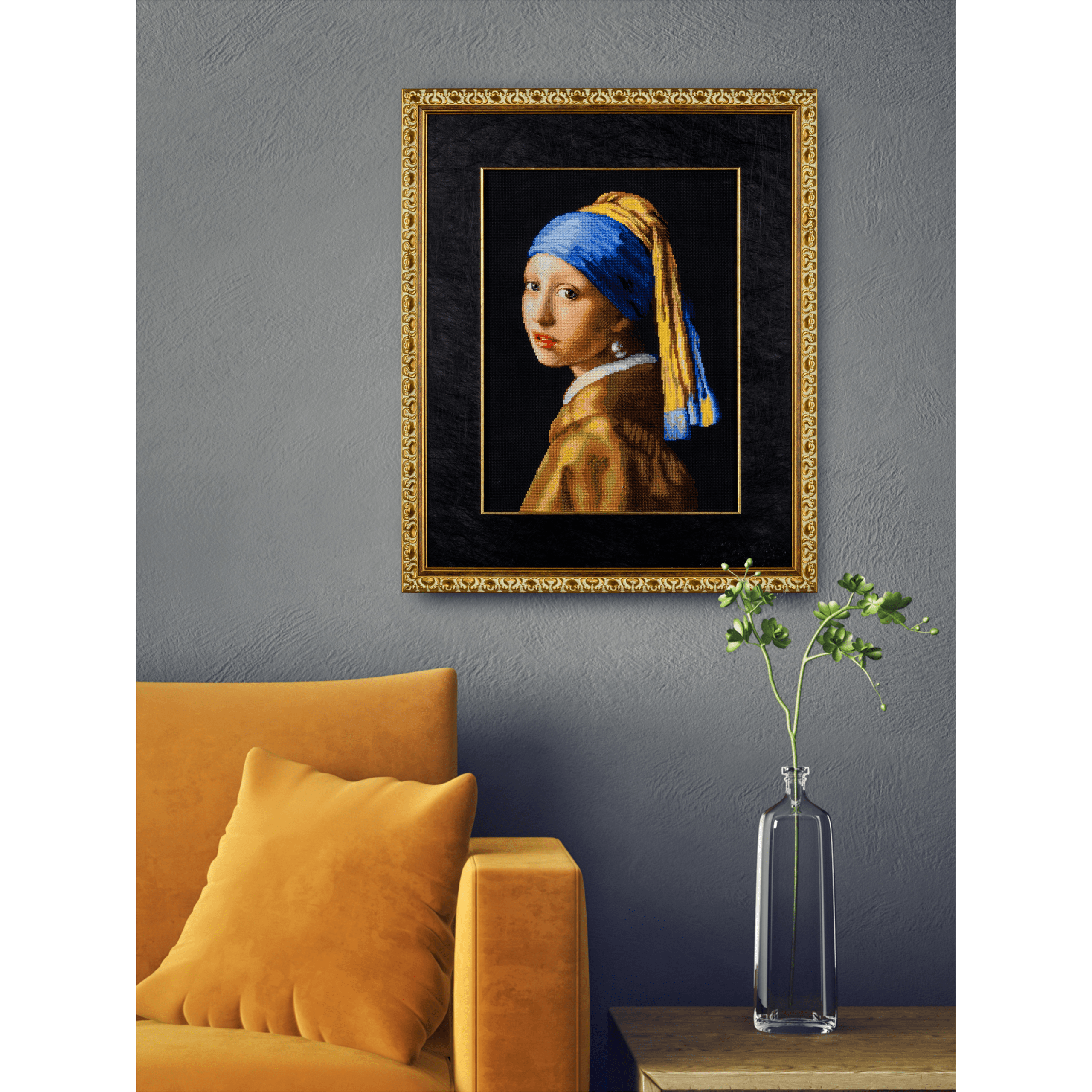 Cross-stitch embroidery of Vermeer’s Girl with a Pearl Earring, featuring a young woman wearing a blue and yellow headscarf and pearl earring. Set against a dark black background in an ornate silver frame. Design from RIOLIS kit 100/063.