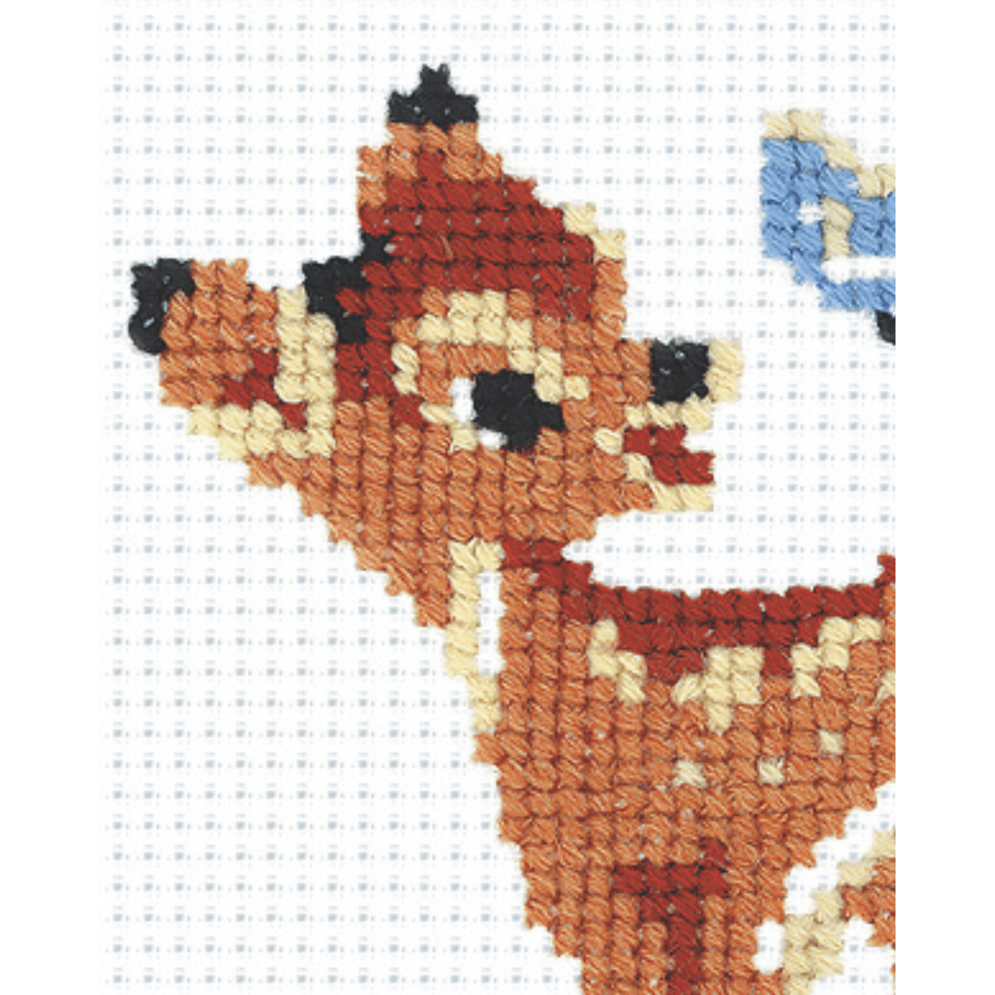 Small cross-stitch design of a young doe with a blue butterfly resting on its tail, surrounded by blue flowers.