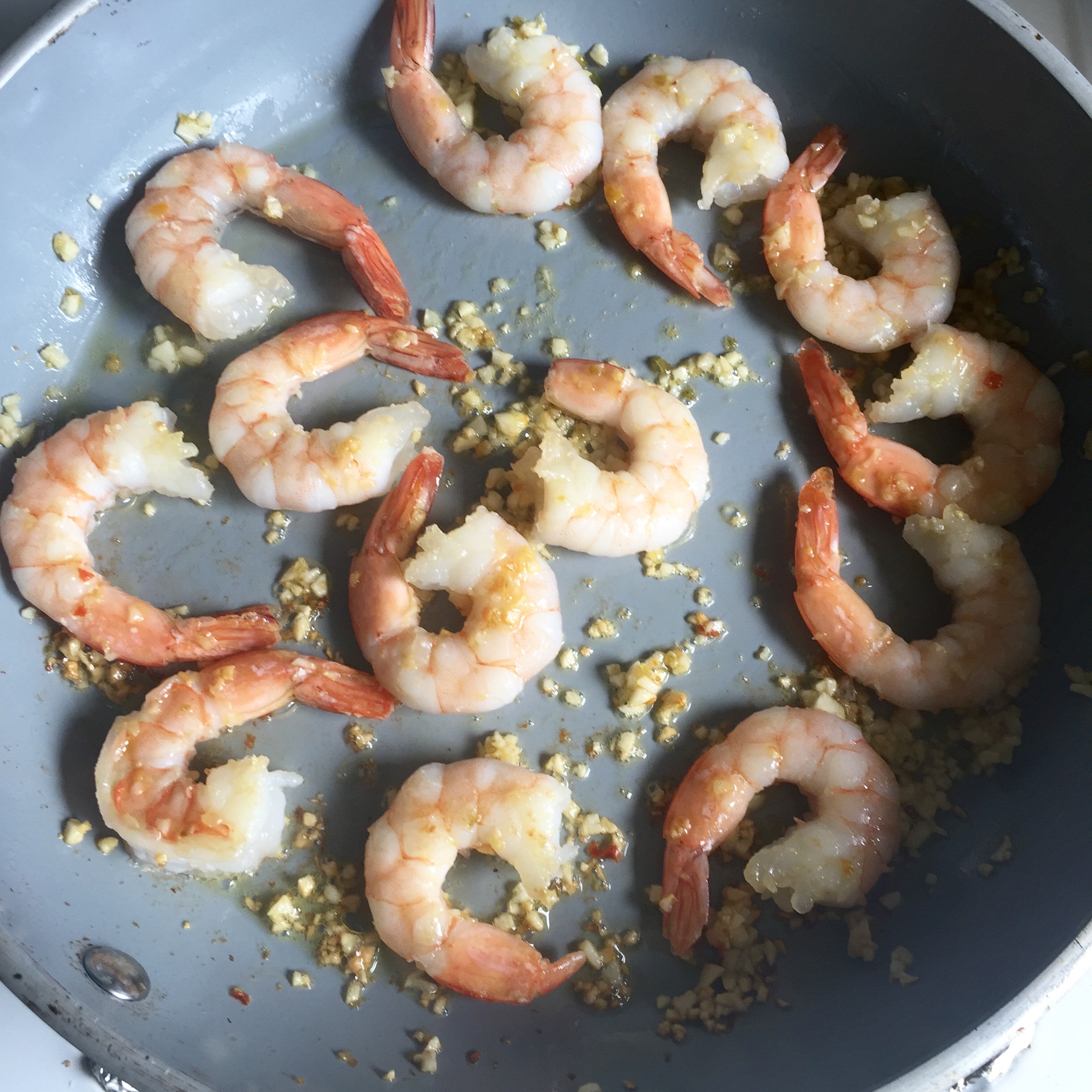 Sautéing the shrimp with garlic