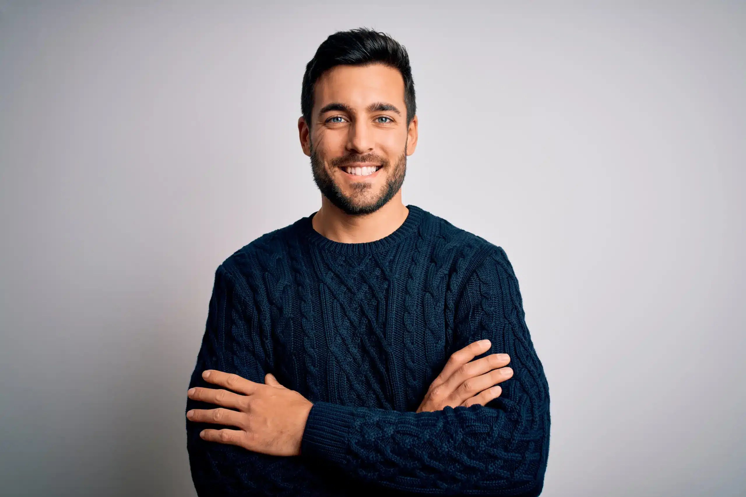 A handsome man with a confident smile, possibly a patient of Same Day Dentistry in Thayne at Riverside Dental