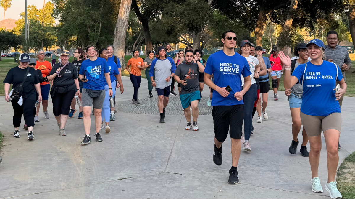 A group of runners in blue shirts.