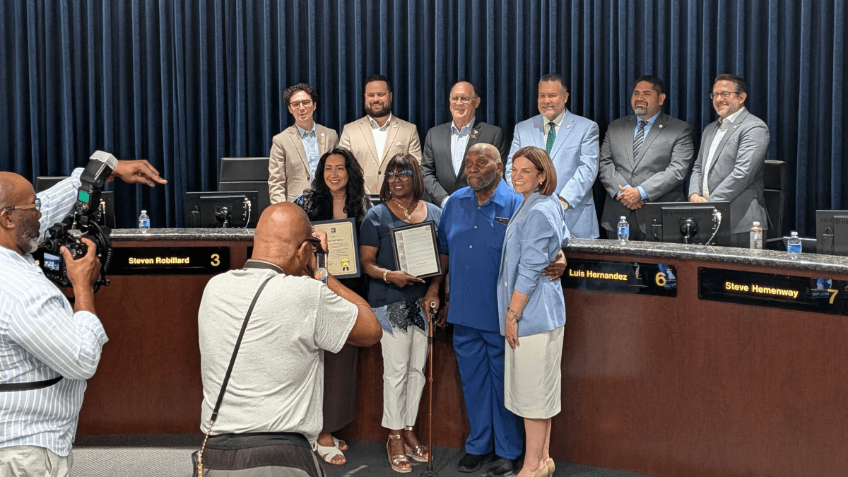 Dell Roberts poses for a photo with the Riverside City Council