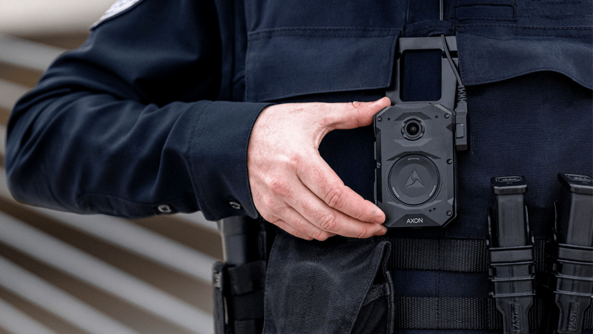 A law enforcement officer activates the Axon Body 4, the latest model of body-worn cameras offered by Axon Enterprise, Inc.