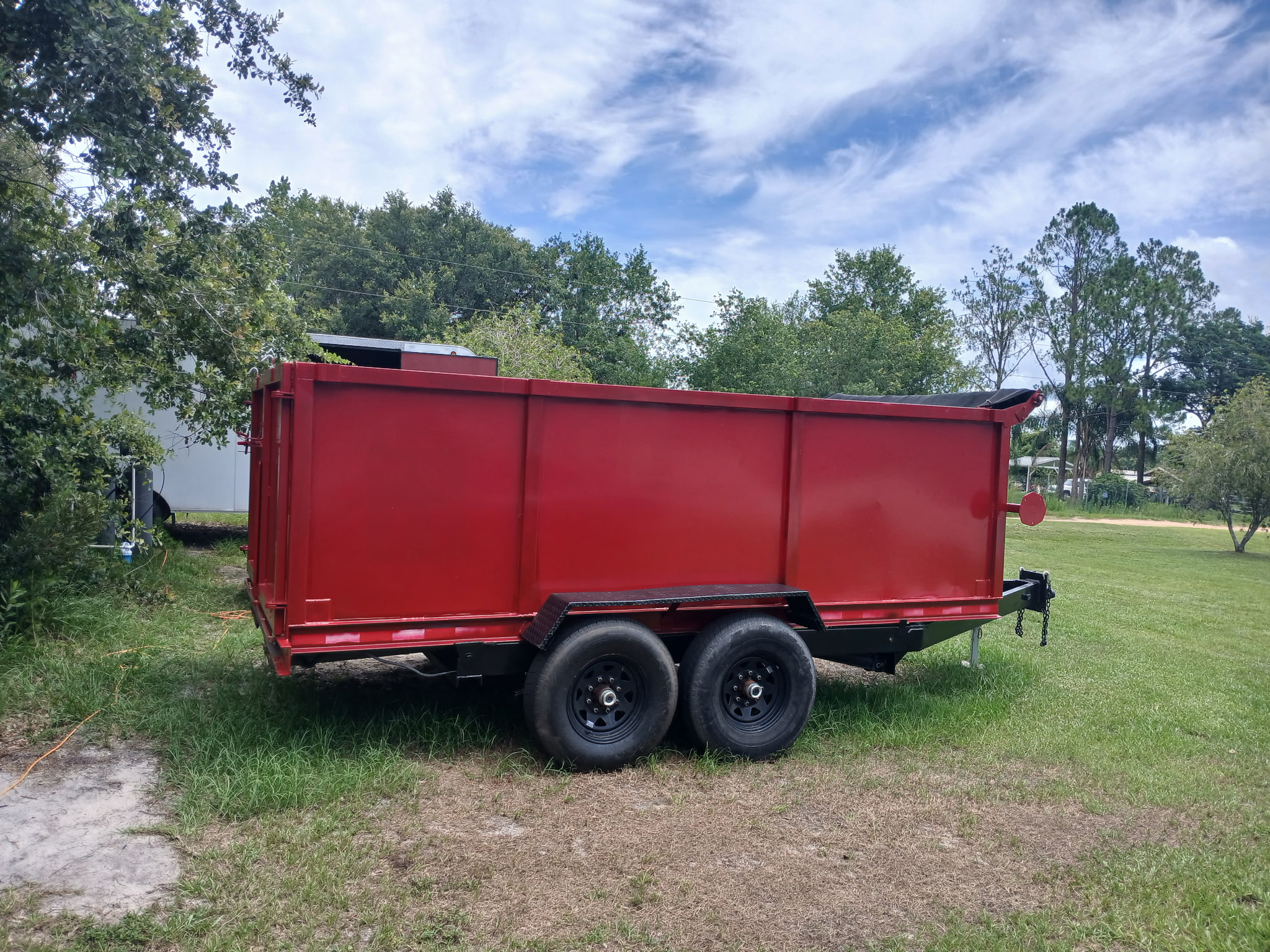 Red dump trailer.