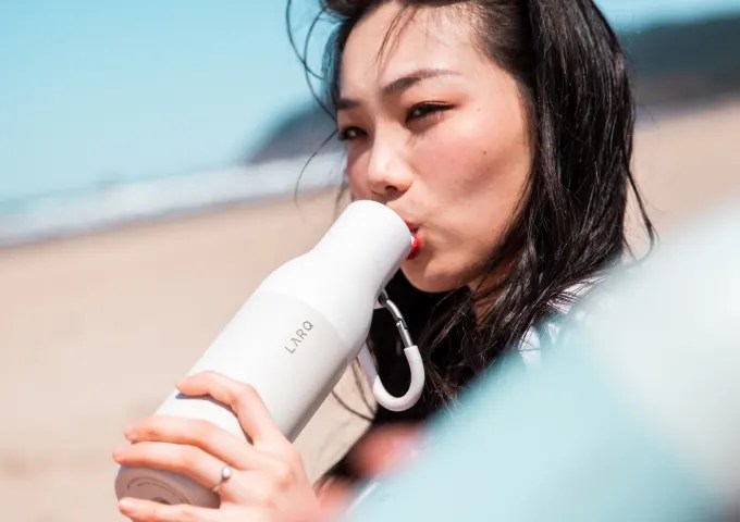 drinking from a larq water bottle