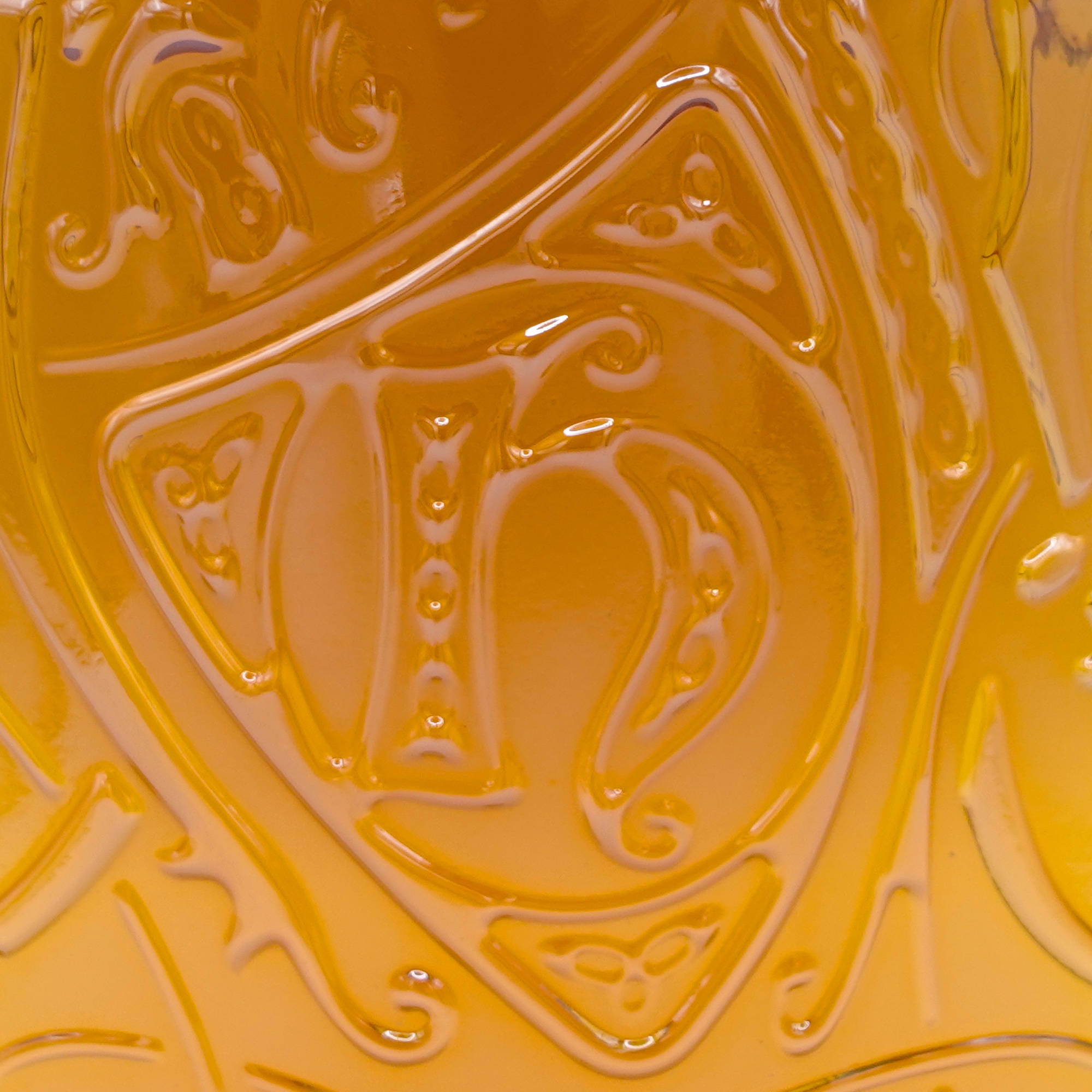 Detail of the Highland Park logo embossed on the bottle glass
