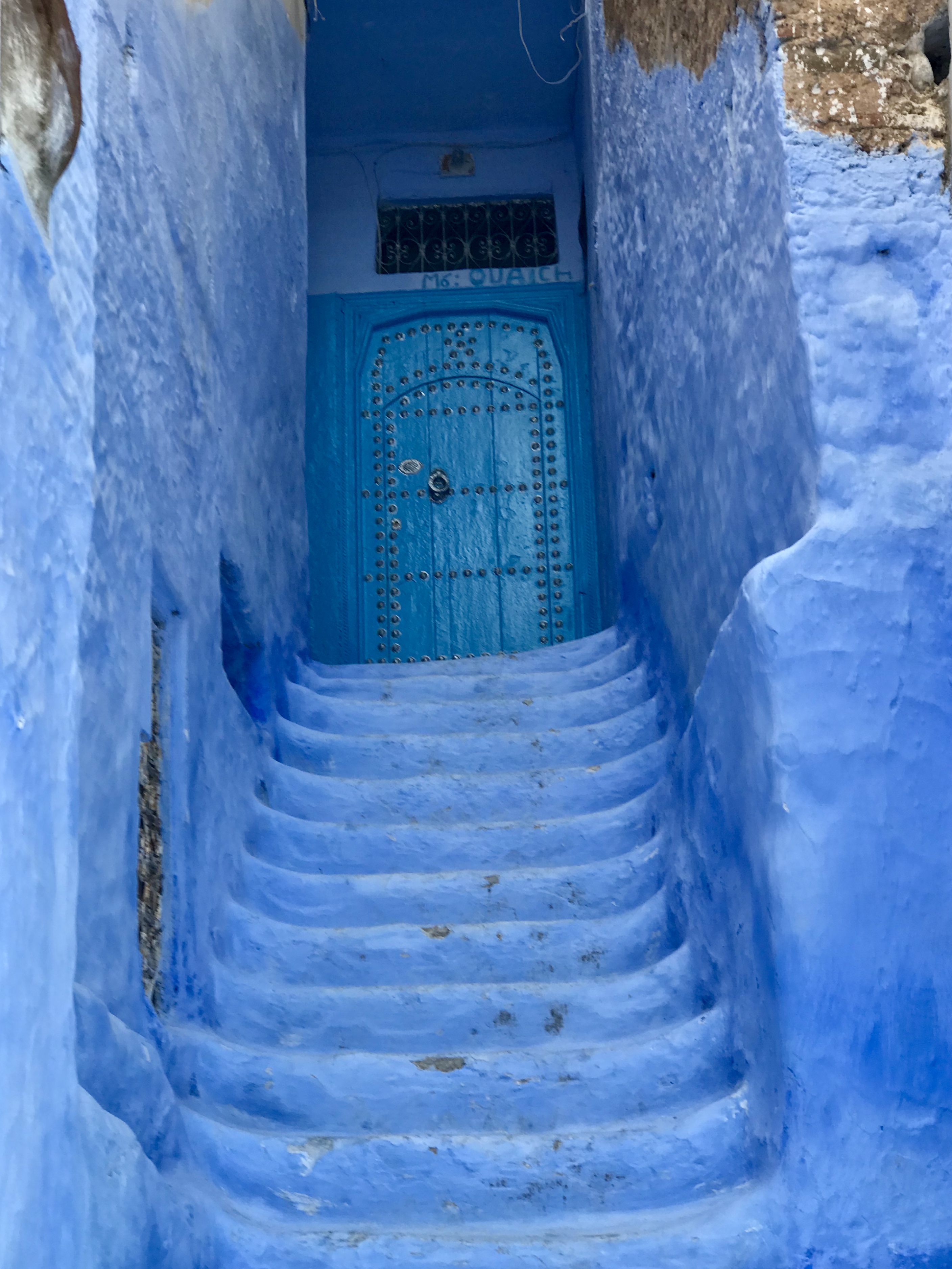 Blue Stairway to cool blue door