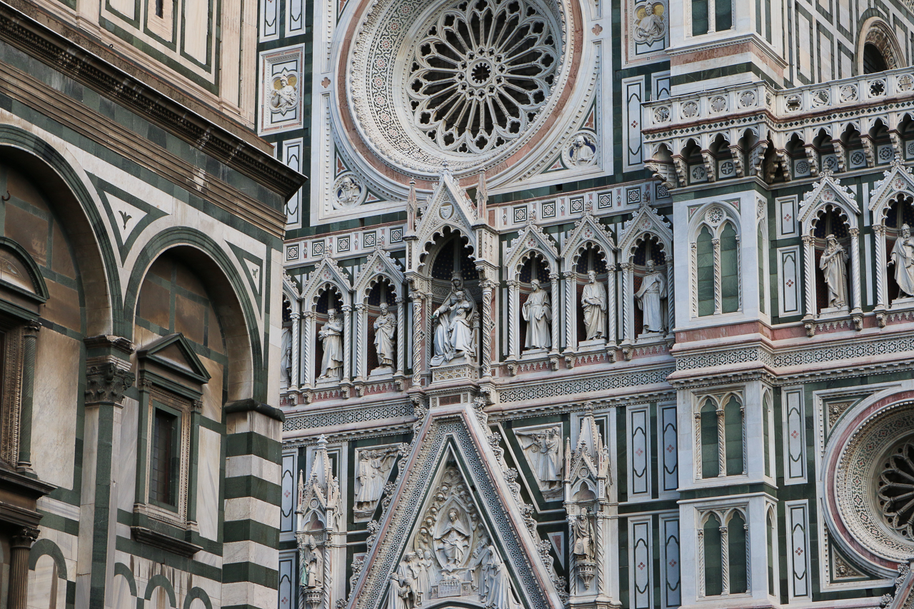 You can see some of the grand figures on the facade of the Florence Cathedral.