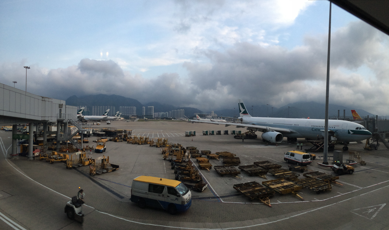 This is a photo of the Hong Kong airport and a Cathay Airlines plane.