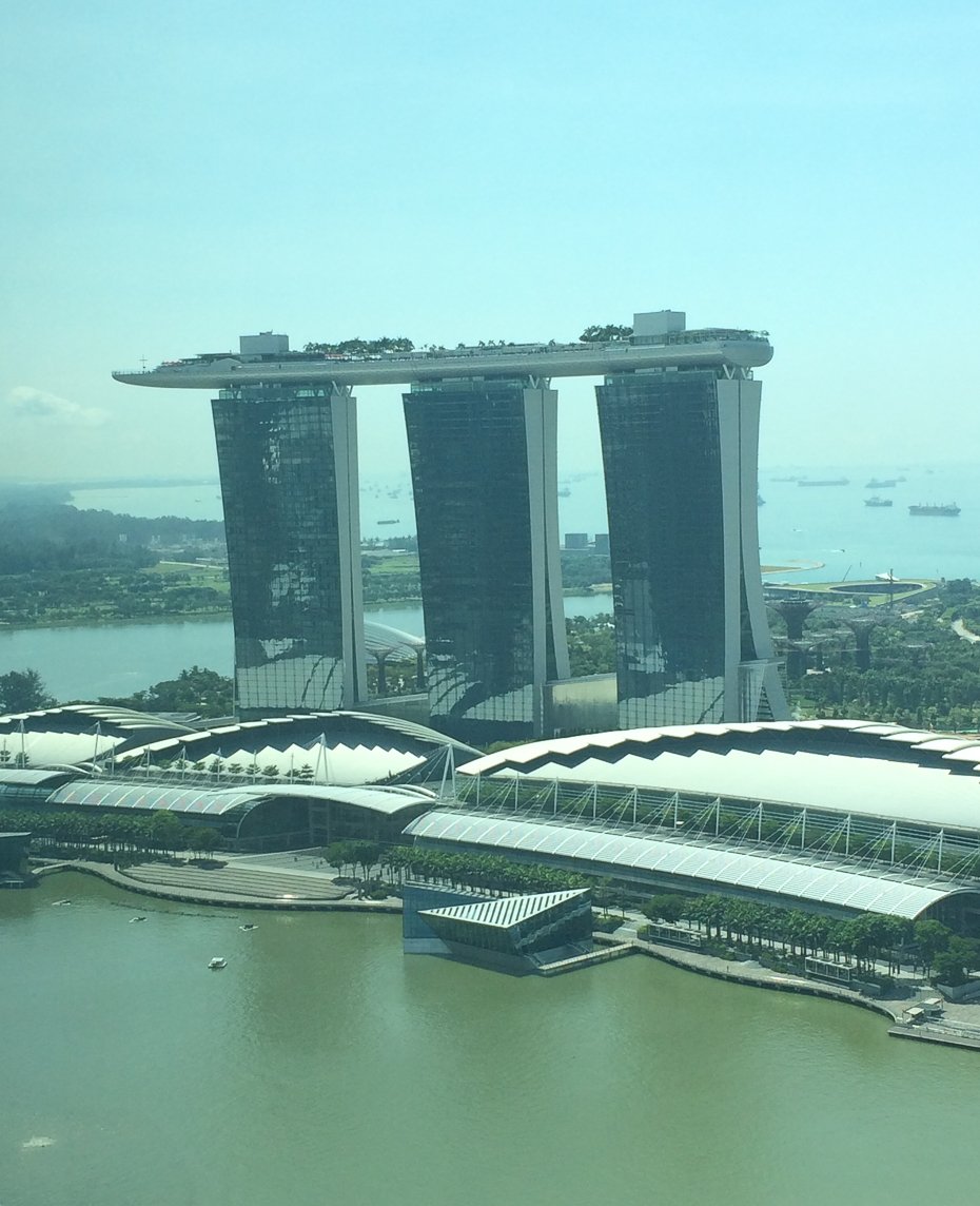 This is from the ANZ Bank building pointing at a very famous hotel in Singapore, Marina Bay Sands Tower 3. Everything in Singapore must have Fengshui.