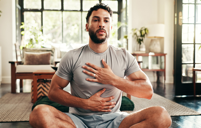 An athletic man practicing box breathing to reduce hyperventilation