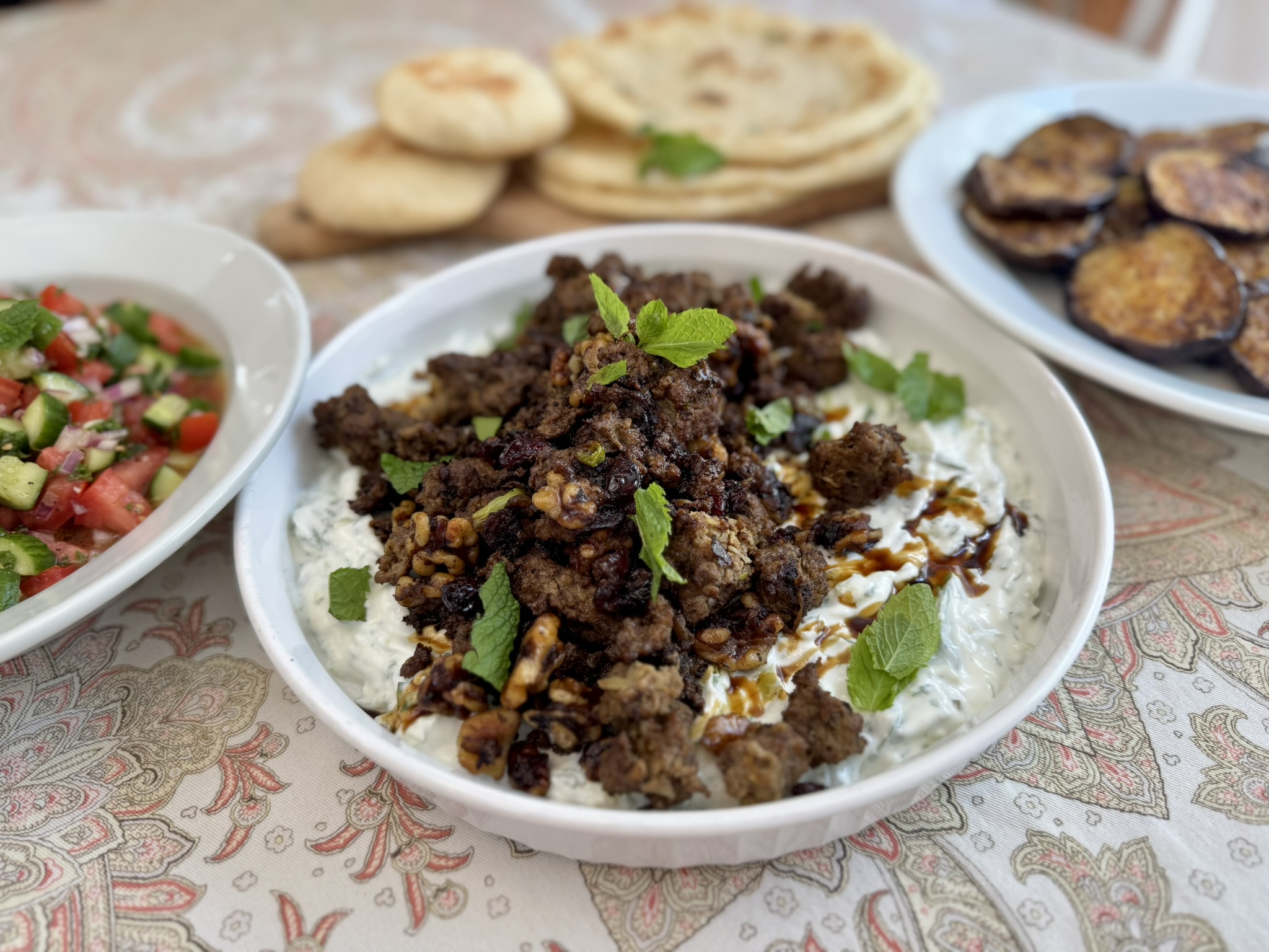 Smashed Beef Kebab with Cucumber Yogurt, Shirazi Salad & Spiced Roasted Eggplant