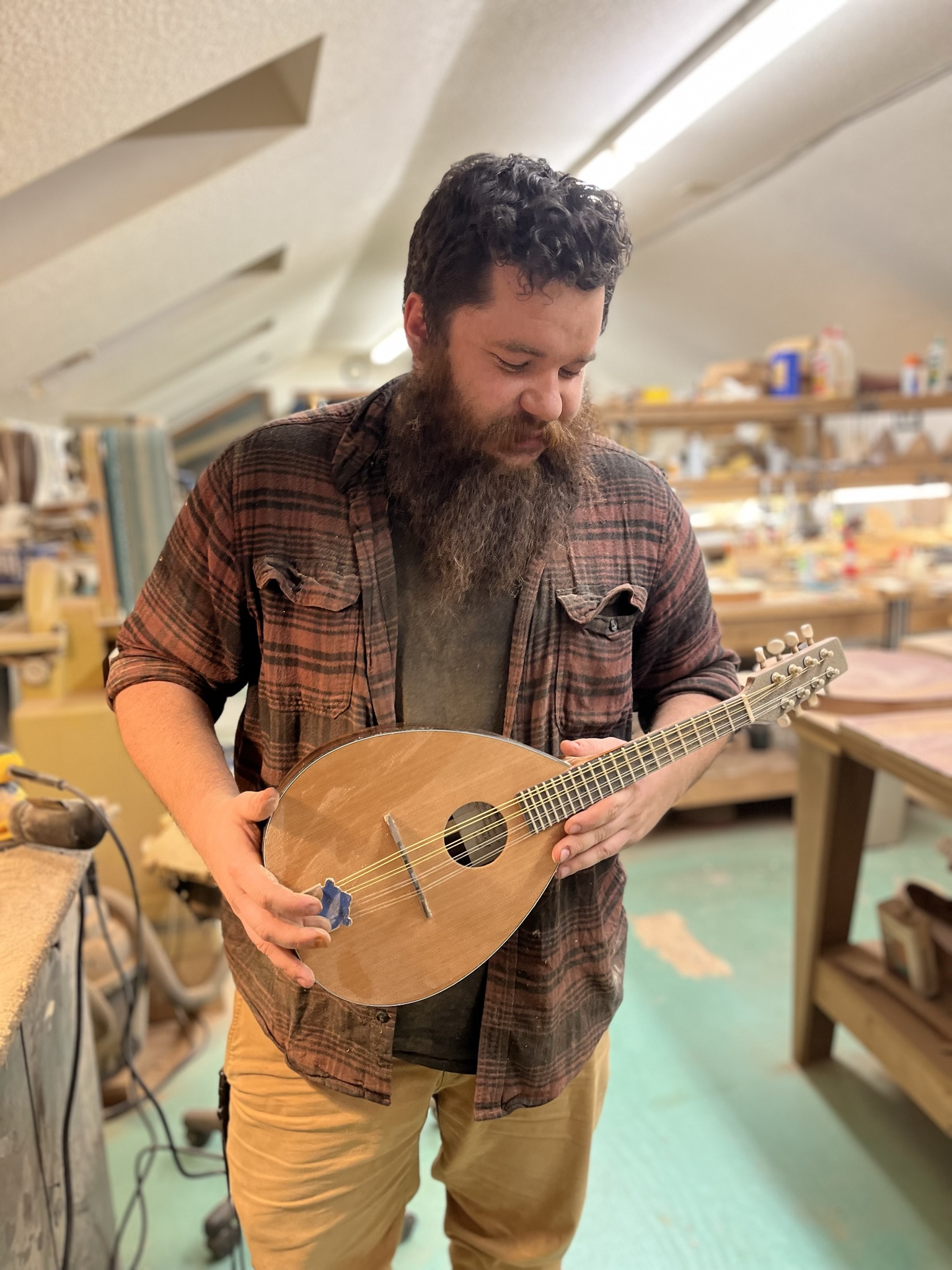 Connor Bentcik holding a mandoline of hi